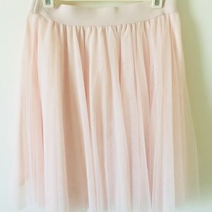 Light pink, fluffy shirt. Size M